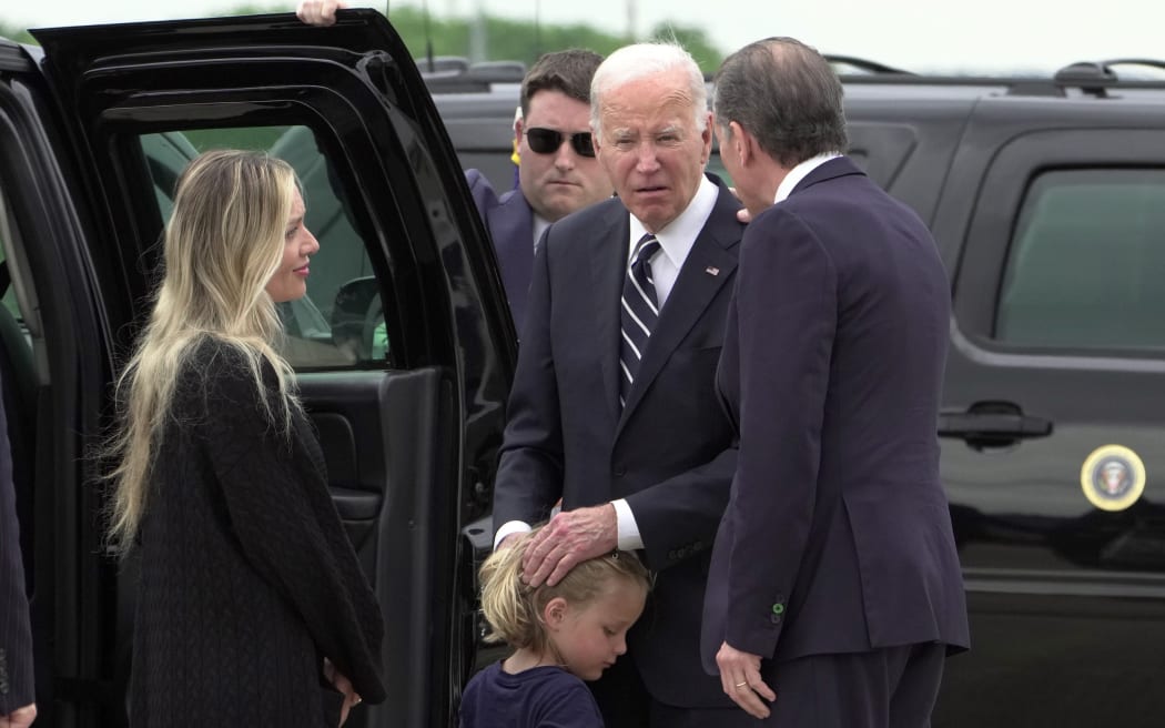 President Joe Biden talks with his son Hunter Biden and wife Melissa Cohen Biden, and grandson Beau, as he arrives Delaware Air National Guard Base in New Castle, Del., Tuesday, June 11, 2024.