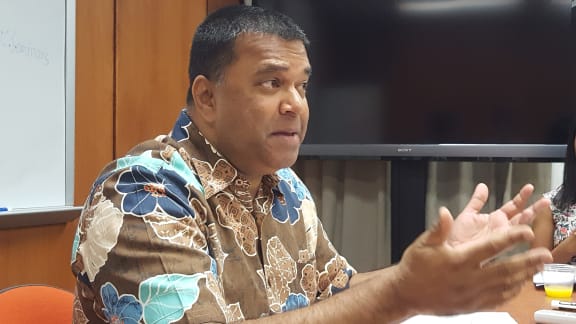 Head and shoulders picture of man wearing Hawaii shirt