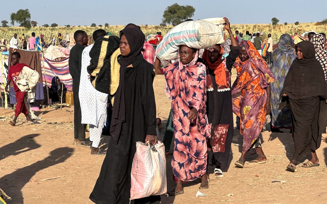 Displaced Sudanese who fled El-Fasher after the city fell to the Rapid Support Forces (RSF), arrive in the town of Tawila in war-torn Sudan's western Darfur region on 28 October, 2025.