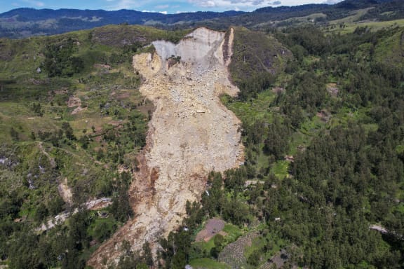 An aerial view of the landslide in Yambali village, in the Highlands of Papua New Guinea, Monday, 27 May, 2024. Authorities fear a second landslide and a disease outbreak are looming at the scene of Papua New Guinea's recent mass-casualty disaster.