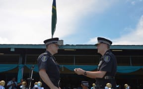 The new Solomon Islands police commissioner Matthew Varley farewells outgoing commissioner Frank Prendergast.