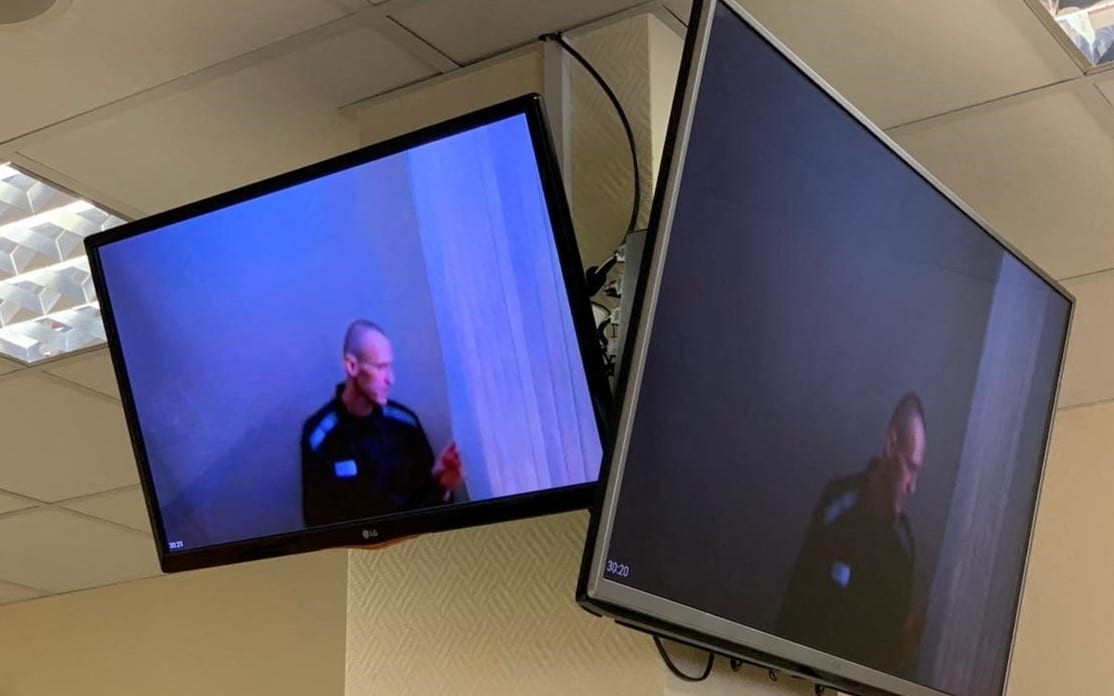 Alexei Navalny appears via a video link from prison before a court hearing to consider an appeal against his defamation verdict, at Moscow's Babushkinsky district court on April 29, 2021.