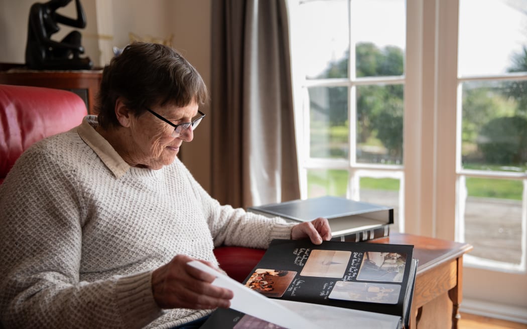 Kerry Hodgson sits in her lounge looking through her photo albums. Most of those memories she no longer recalls,which she blames the 307 electroconvulsive therapy shocks she had over ten years to treat severe depression