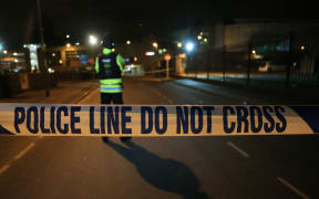 British police guard the entrance to the Manchester Arena stadium in Manchester, United Kingdom on May 23, 2017.