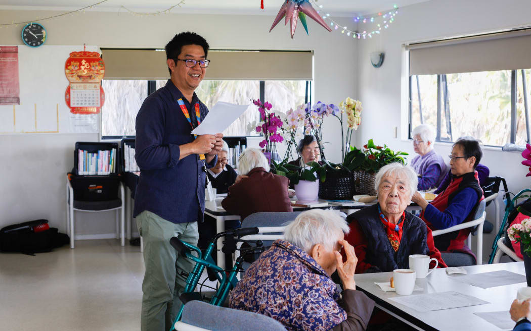 Hau-Ren Hung reading an article at Deverton House Rest Home.