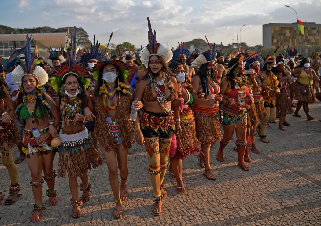 In this file photo taken on August 26, 2021 indigenous women protest outside the Supreme Court in Brasilia.