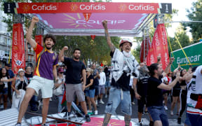 Pro-Palestinians protestors invade the street during the scheduled 21st and last stage of the Vuelta a Espana.