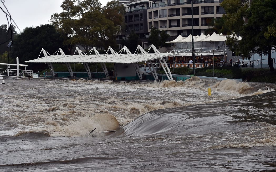 A ferry terminal is submerged by the overflowing Parramatta river in Sydney on Sunday 5 June 2016.