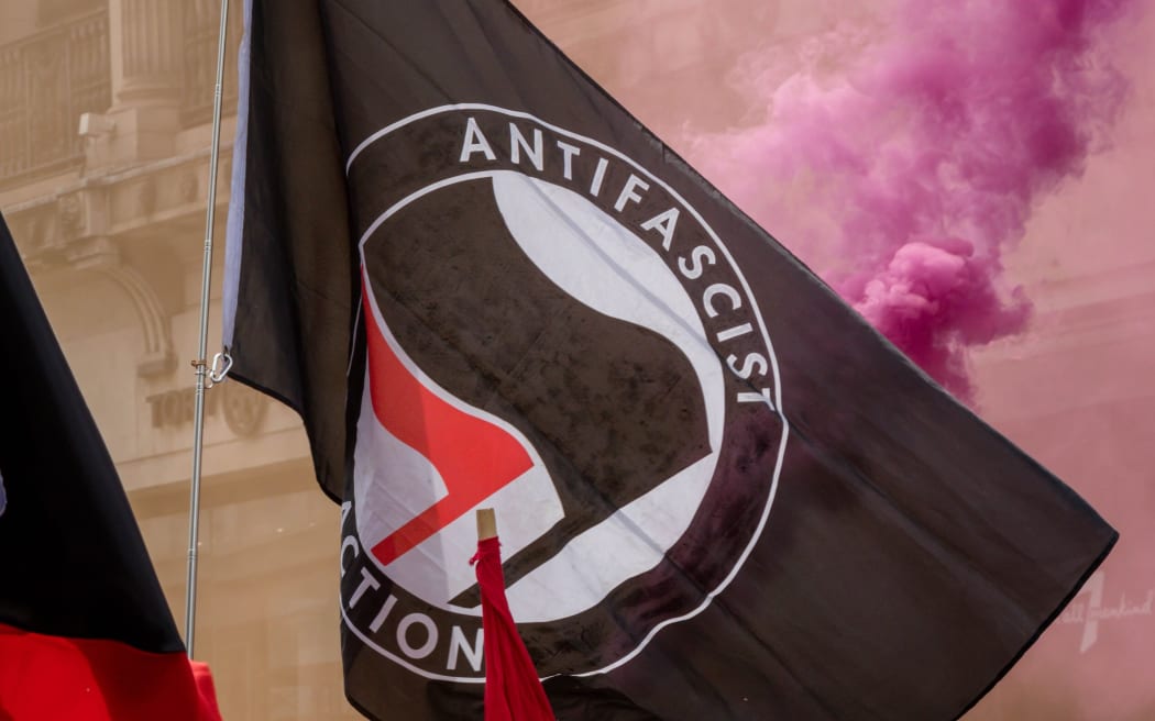 The antifa flag being displayed at an anti fascist demonstration in opposition to a rally by supporters of the former EDL leader Tommy Robinson