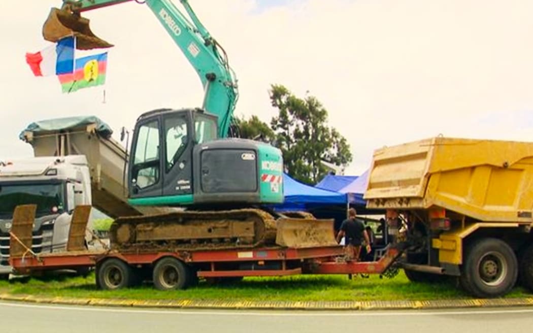 Trucks and caterpillars barring access to service stations in Nouméa on 23 March 2024.
