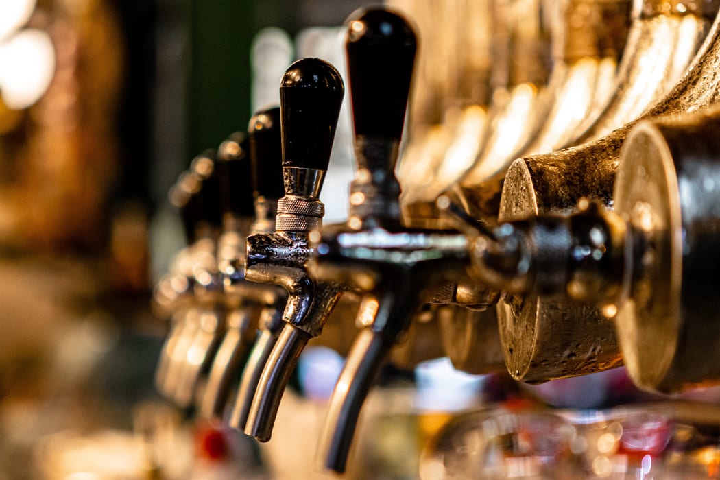 Beer taps in a bar.