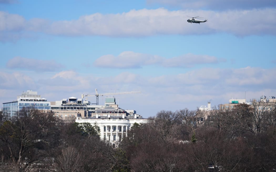A helicopter carrying the Bidens flies over the White House following President Donald Trump's inauguration on January 20, 2025.