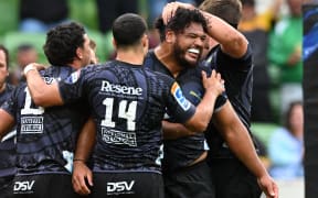 Pasilio Tosi of the Hurricanes celebrates scoring the game winning try in golden point during the Super Rugby Pacific match between the Hurricanes and the Reds.