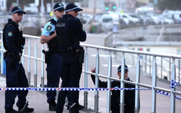 Police patrol Bondi Beach in Sydney on 15 December 2025  as they investigate the scene where two gunmen shot and killed 15 people at a Jewish celebration.