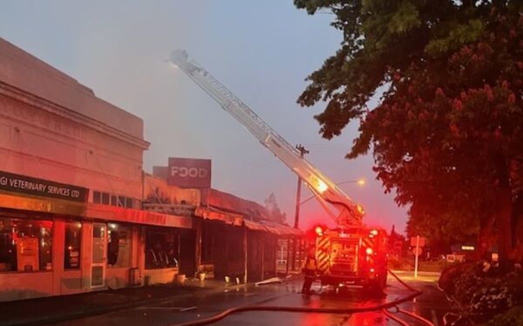 A person was hospitalised after a fire in Fairlie in the early hours of Monday 20 November 2023 which also gutted three shops.
