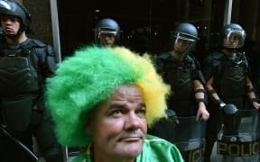 Riot police forces stand guard during a demonstration by striking subway workers in Sao Paulo.