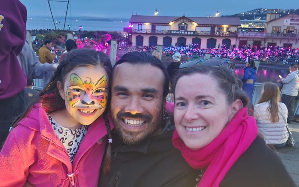 Seven-year-old Naiya (L), Claudio Escutia, and Carrie Gardyne at the lagoon in Wellington.