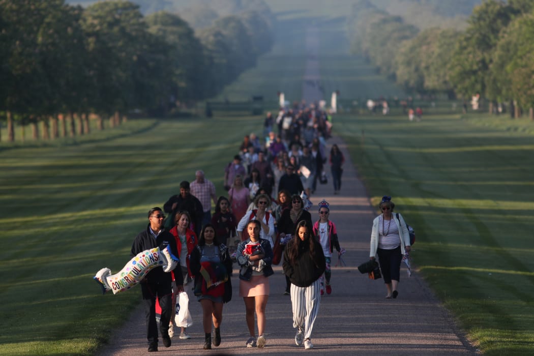 Well wishers arrive on the Long Walk leading to Windsor Castle ahead of the wedding and carriage procession of Britain's Prince Harry and Meghan Markle