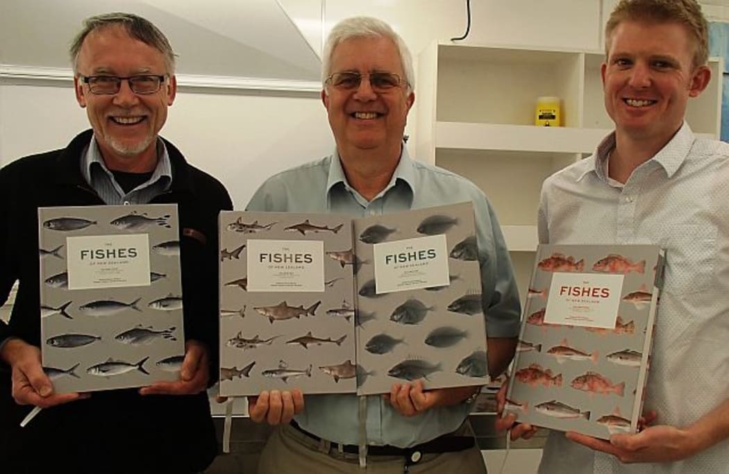 Andrew Stewart, Clive Roberts and Carl Struthers, editors of The Fishes of New Zealand, holding up the four volumes of the book