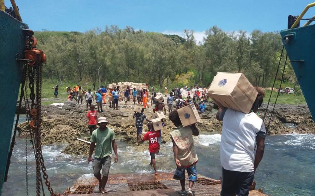 Emergency supplies are unloaded on Aniwa.