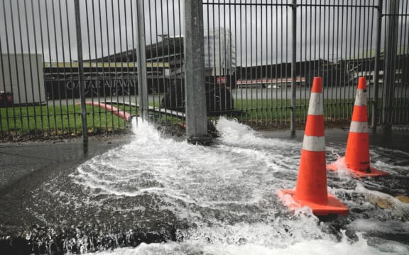 Water is pumped out of Auckland's Eden Park after severe rainfall flooded the grounds.