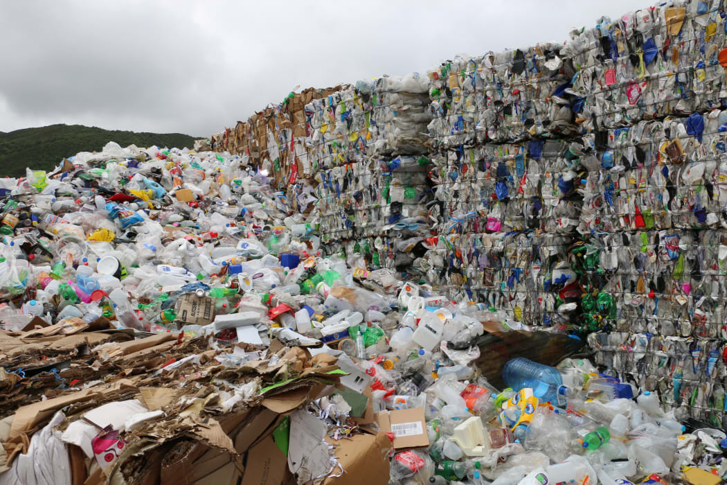 Bales of mixed plastic wait for export at Wellington's recycling facility at Seaview.
