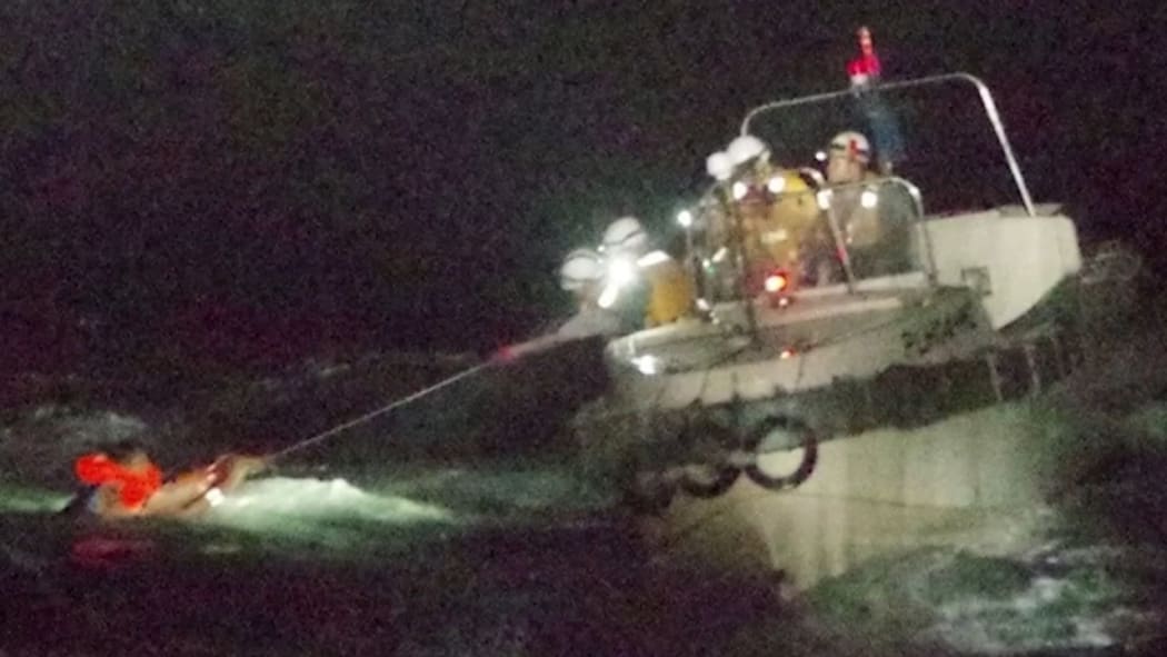 One person has been rescued after a cargo ship capsized in a typhoon off Japan's coast.