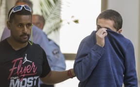 American-Israeli Jewish teenager Michael Kadar (R), accused of making dozens of anti-Semitic bomb threats in the United States and elsewhere.