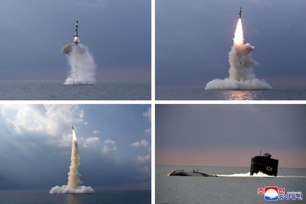 This combination of pictures taken on October 19, 2021 and released from North Korea's official Korean Central News Agency (KCNA) on October 20, 2021 shows test fire of a new type submarine-launched ballistic missile in an undisclosed location in North Korea.
