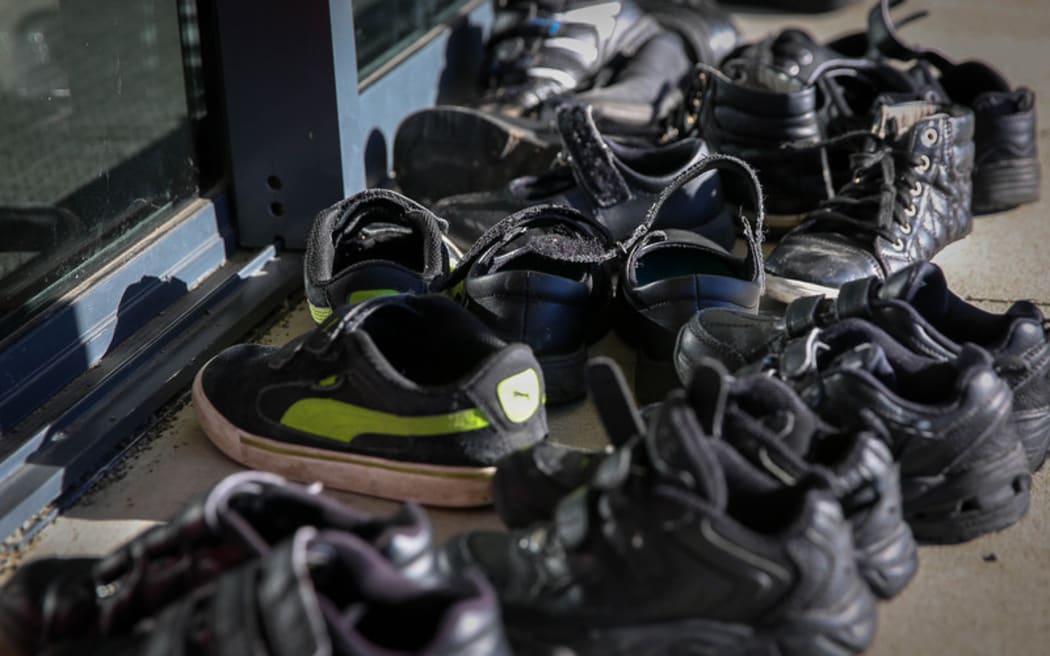 Children's shoes outside the classroom in Linwood Primary School, Christchurch.