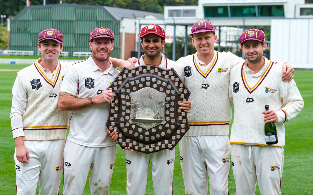 Northern Districts players celebrate winning the 2024/25 Plunket Shield.