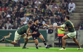 Eben Etzebeth of South Africa, Richie Mo’unga of New Zealand and Damian de Allende of South Africa during the New Zealand All Blacks v South Africa Springboks rugby union match at Mbombela Stadium, South Africa on 6 August 2022.