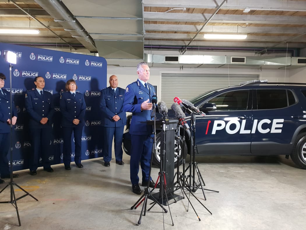 Police Commissioner Mike Bush and the new vehicle in the background.