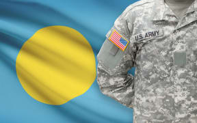 American soldier with flag on background - Palau