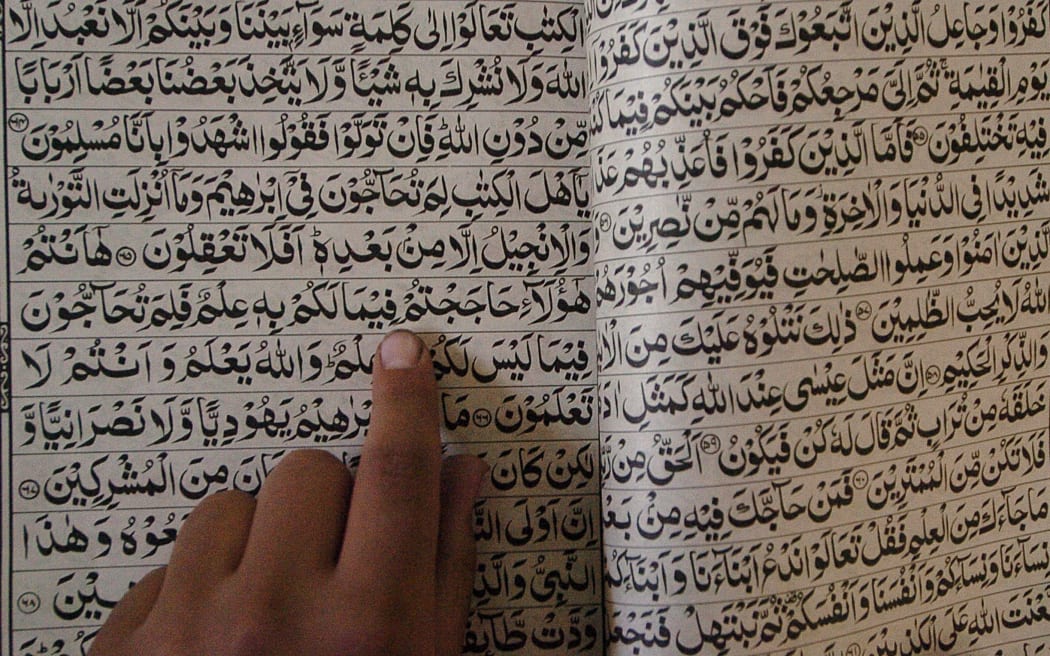 An Afghan boy reads the Quran at the Hazrat-e-Bilal madrassa in Kabul.