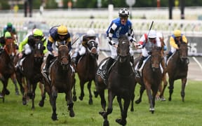 Jockey Mark Zahra rides Gold Trip to win 2022 Melbourne Cup at Flemington Racecourse.