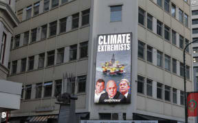 Greenpeace has put a billboard up on Lambton Quay near Parliament in Wellington depicting Christopher Luxon, Winston Peters and David Seymour as "climate extremists".