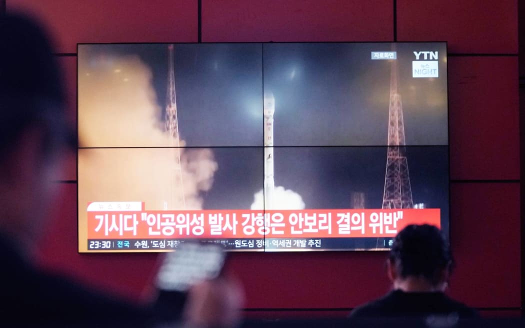 A TV screen shows a file image of North Korea's rocket launch during a news program at a bus terminal in Seoul, South Korea, Monday, May 27, 2024. North Korea on Monday, May 27, 2024, launched a missile into the sea, Japan and South Korea said, hours after North Korea announced plans to put a rocket into orbit apparently carrying its second military reconnaissance satellite. (AP Photo/Ahn Young-joon)