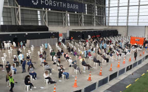 People wait at the vaccination clinic in Dunedin.