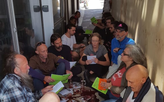 Protesters spilled their own blood on the ground outside the GCSB headquarters in Wellington.