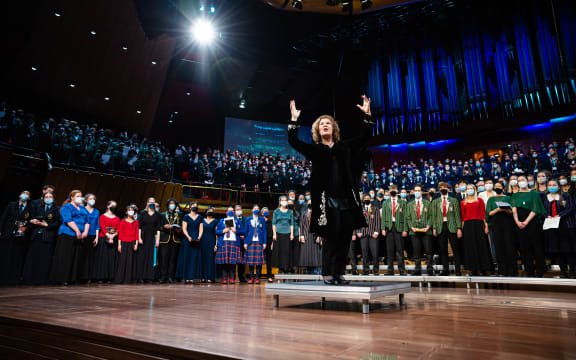 Sue Densem conducting The Big Sing 2022 massed choir at the Christchurch Town Hall