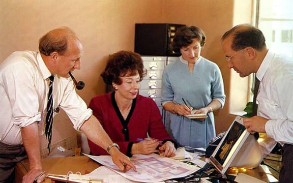 In this 1962 photograph, Vic Staines (production), Jean Wishart (editor), Joy Lee (assistant editor) and Michael Wilson (photographer) discuss the design of the 30th-anniversary issue.