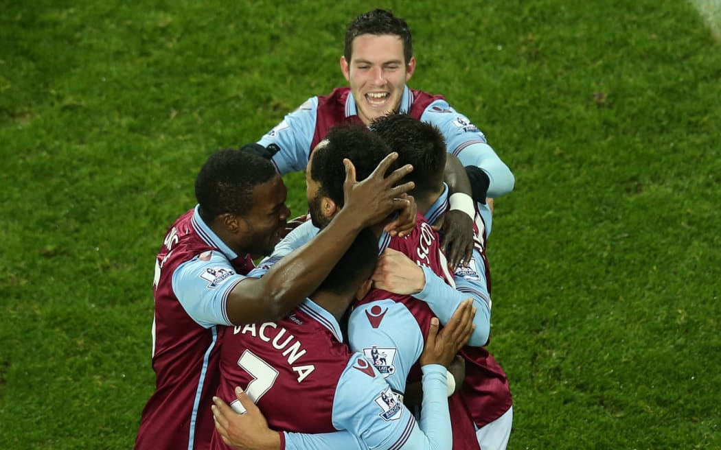 Aston Villa players celebrate a win.