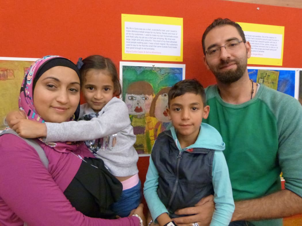 Kutaiba Alakkad with his wife Gianhn Alarioishi and their children.