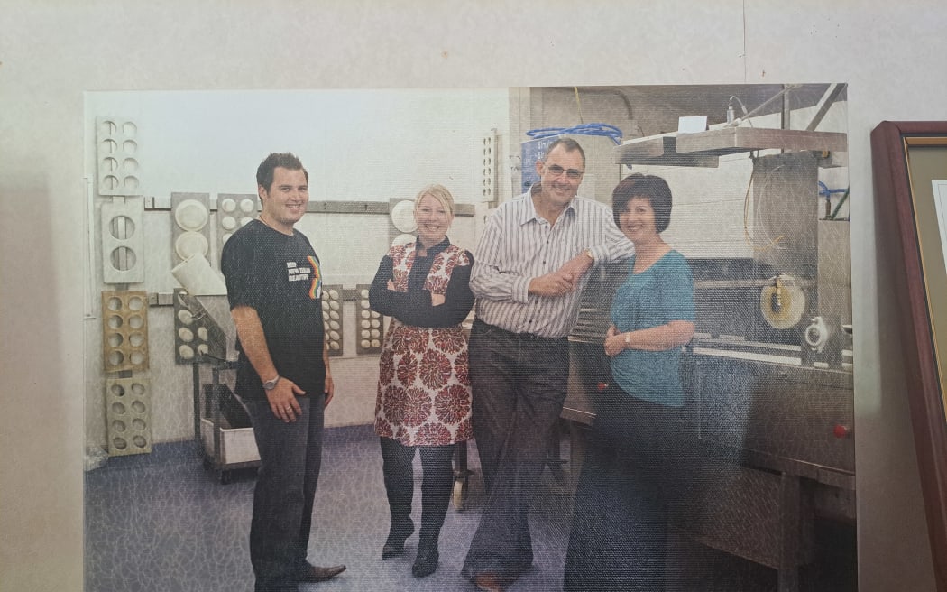 An old photo of Grant and Karen with two workers at the Maketū Pies factory.
