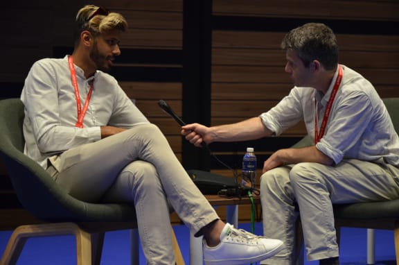 Yusuf Omar talking to Colin Peacock.