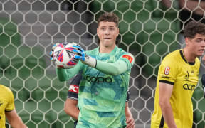 Alby Kelly-Heald of the Phoenix makes a save during the A-League Men Round 19 match between Melbourne Victory and the Wellington Phoenix at AAMI Park in Melbourne, Australia on Friday, February 14, 2025.  (AAP Image/Scott Barbour/ Photosport)