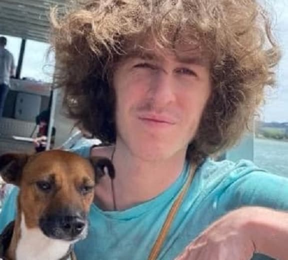 Jordan has brown bushy hair, is of a thin build and around 175cm tall.