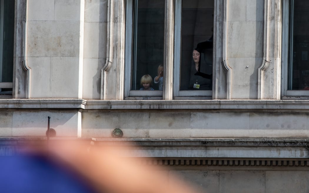 Crowds gather to view the Queen to be laid in state