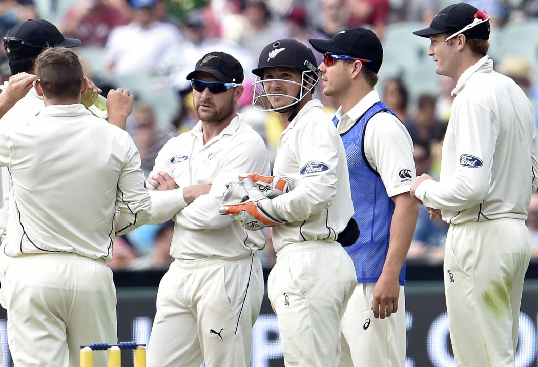New Zealand captain Brendon McCullum, second left, and wicketkeeper BJ Watling wait for the decision over Australian batsman Nathan Lyon's sweep-shot.